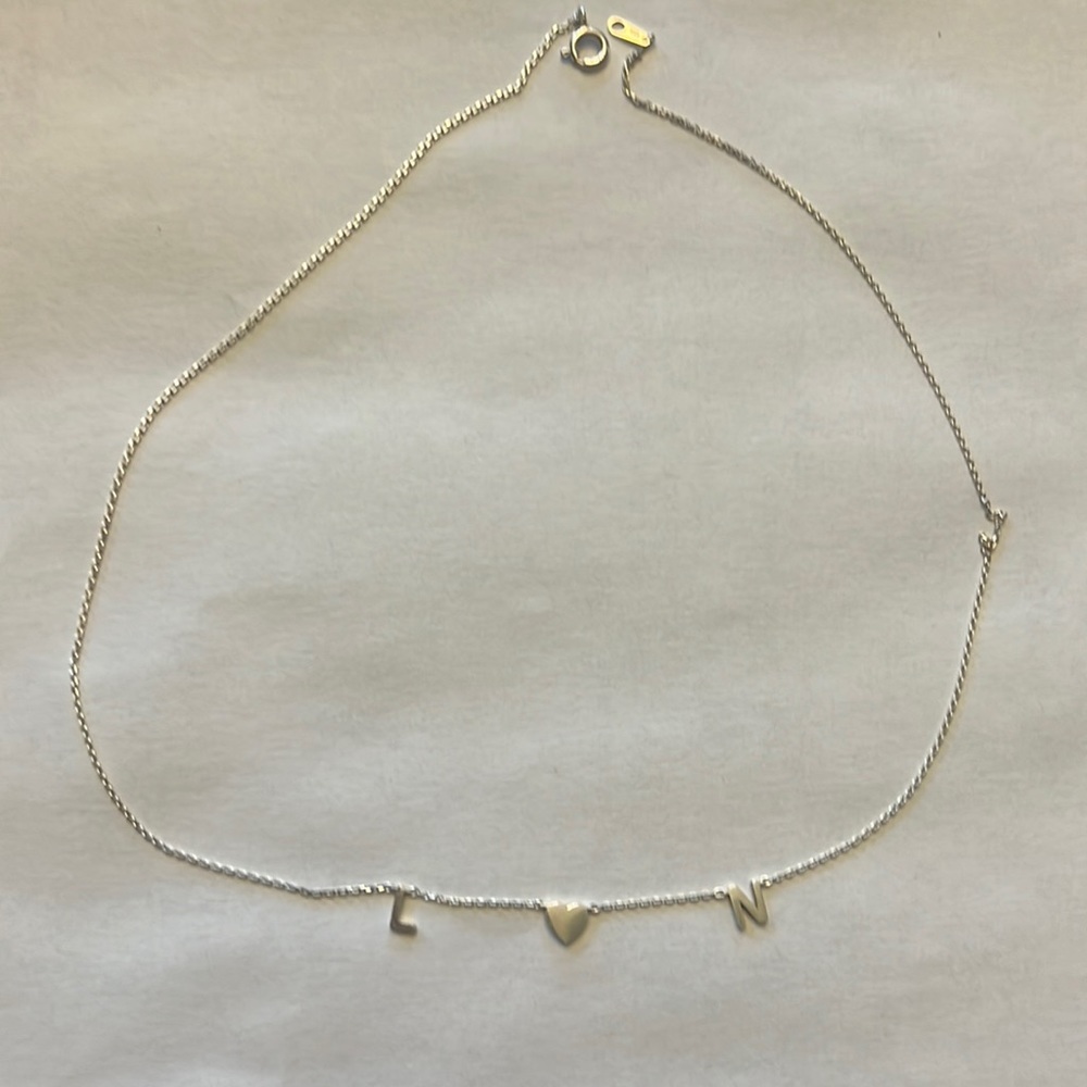 Custom initial necklace. L 💗 N. Purchased from the siskiss.
